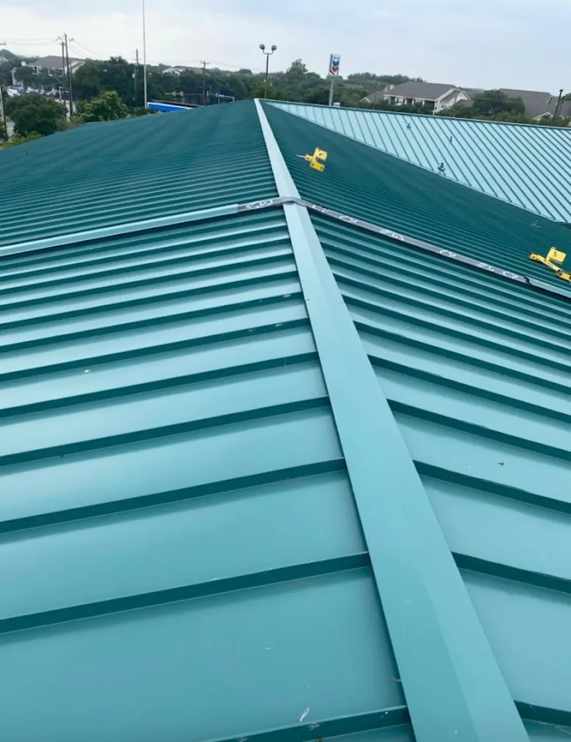 Green commercial metal roof ridge and valley for Metal Roof Repair in Zeeland