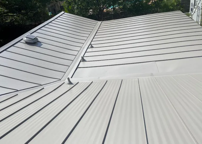 Solar attic fan installed on a metal roof for Roof Ventilation in Zeeland